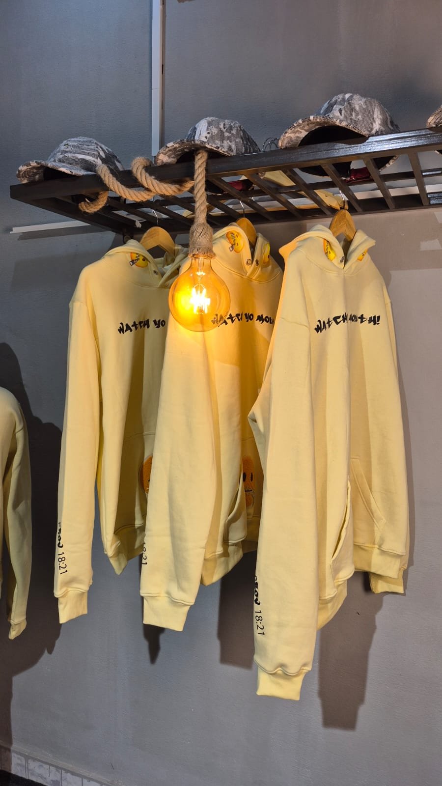 Yellow hoodies on rail