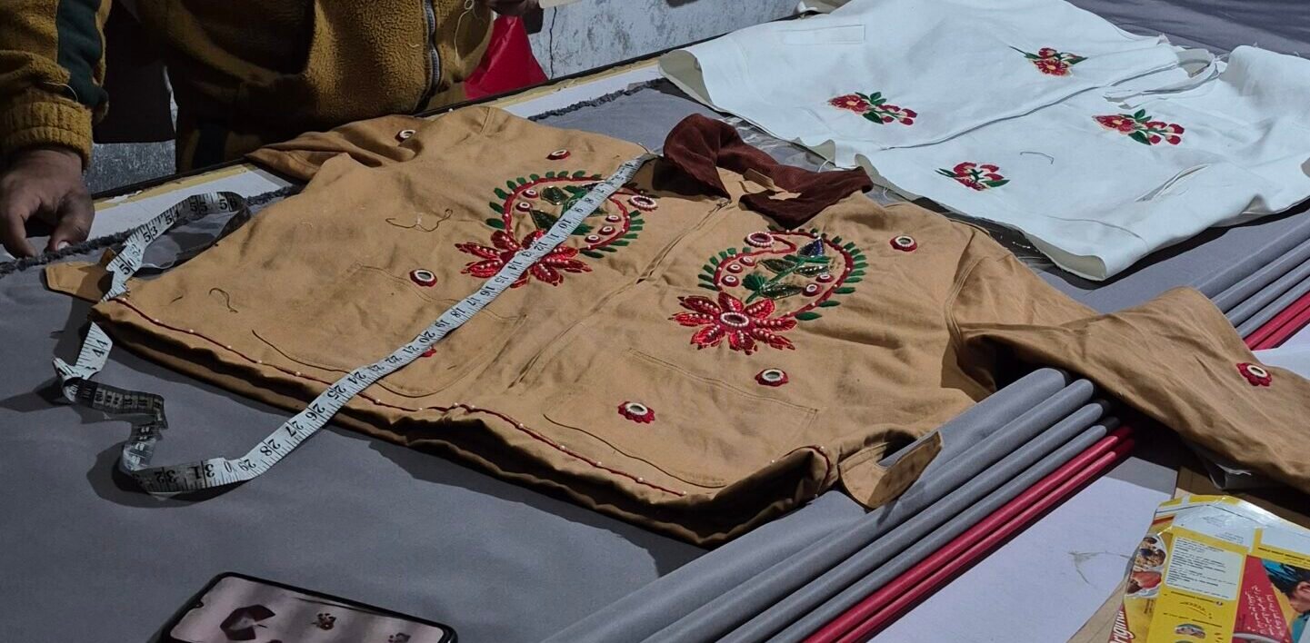 Garment measurements and decoration being checked